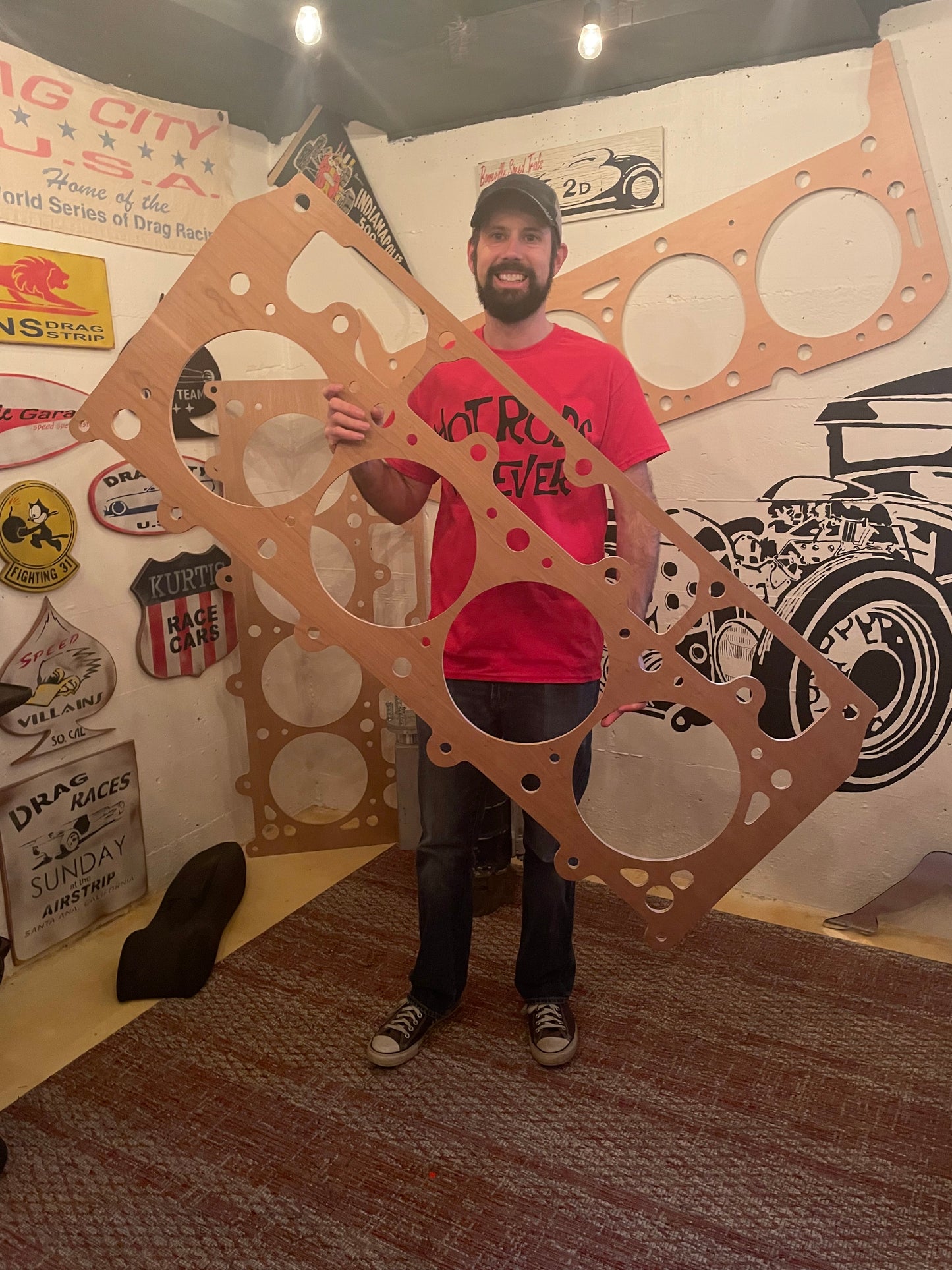 Rod Shop Collective founder standing next to a giant five foot handmade wooden LSX head gasket — Hand Built collection — Louisville, Kentucky
