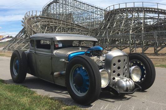 1930 Ford Model A coupe parked in front of the wooden roller coaster at Beech Bend Park in Bowling Green, KY