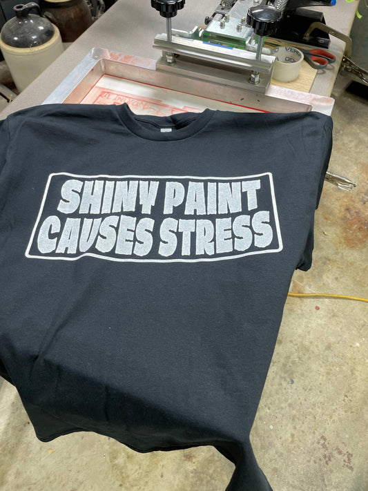 First Shiny Paint Causes Stress shirt hand screen printed on platen press in home garage