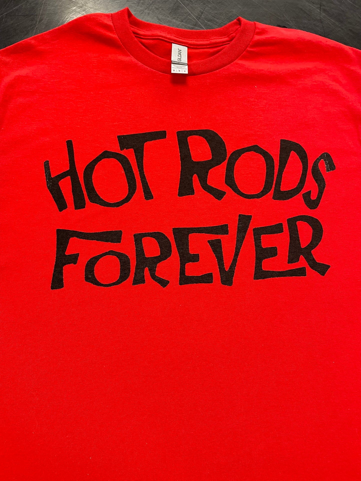 Hot Rods Forever t-shirt graphic detail, hand-lettered black text on red — The OG Collection by Rod Shop Collective