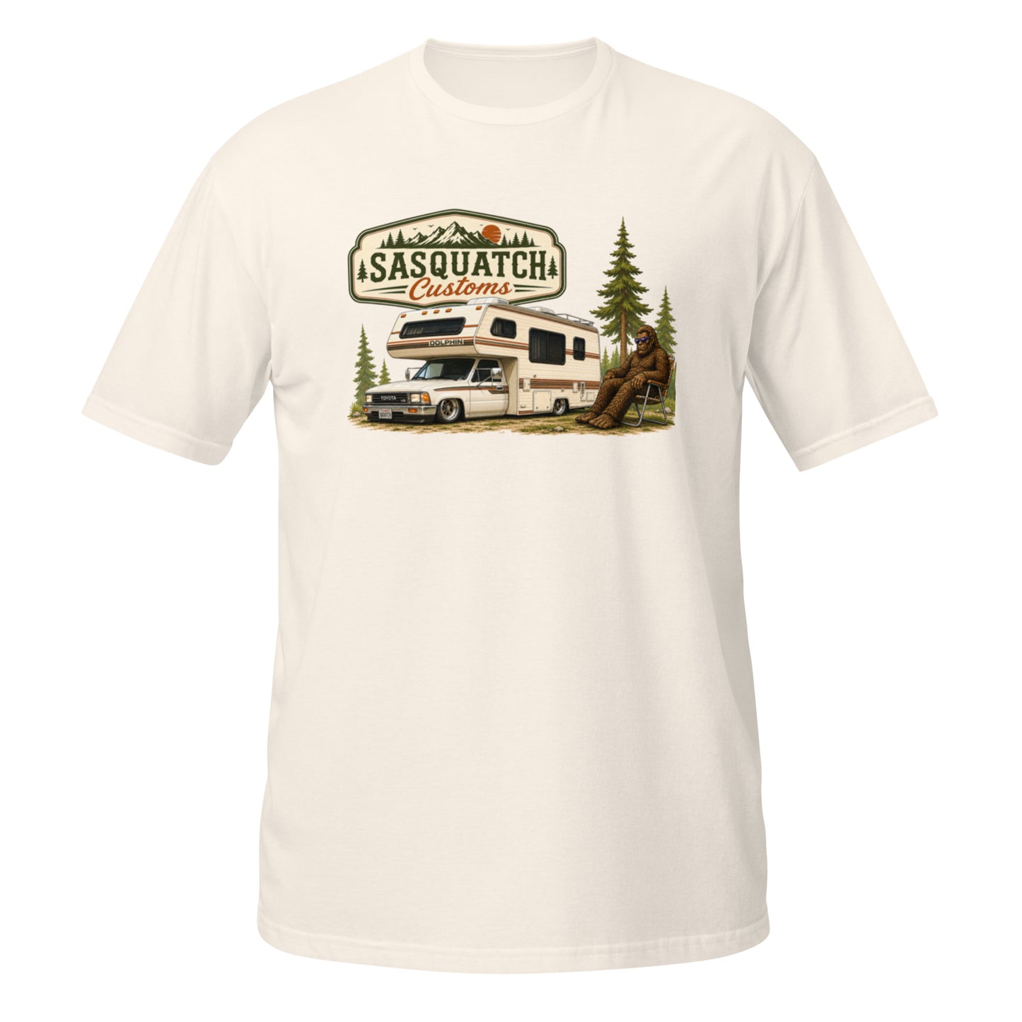 Sasquatch Customs Camping Series t-shirt — Bigfoot sitting in a vintage lawn chair next to a 1989 Toyota mini truck camper in a pine forest — funny Sasquatch camping tee on natural — Rod Shop Collective