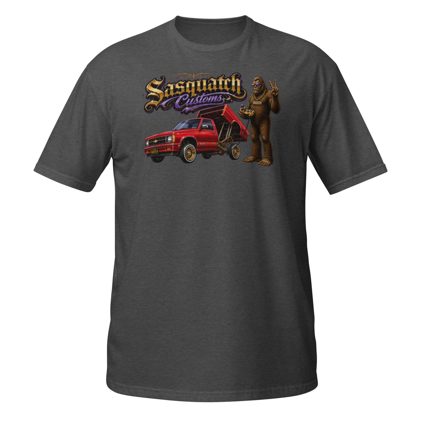 Sasquatch Customs Lowrider Series t-shirt — Bigfoot hitting the switches next to a Chevy S10 bed dancer mini truck on hydraulics — funny Sasquatch mini truck tee on black — Rod Shop Collective