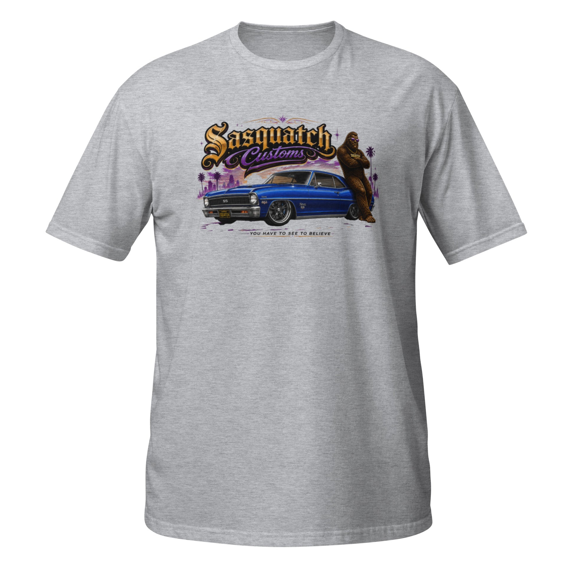 Sasquatch Customs Muscle Car Collection t-shirt — Bigfoot leaning on a marina blue 1967 Chevy Nova SS pro-touring build on Forgeline billet wheels in front of a city skyline with arms crossed — the car that started it all — funny Sasquatch muscle car tee on sport grey — Rod Shop Collective