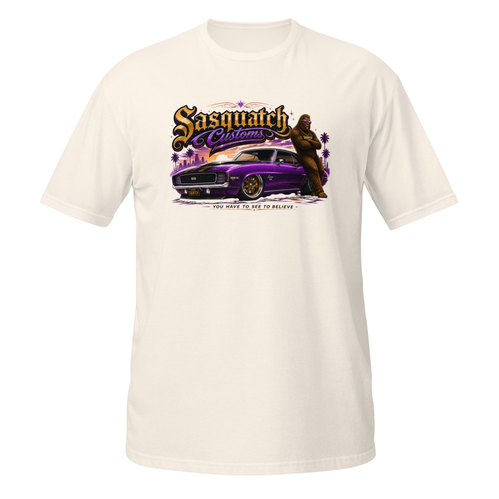 Sasquatch Customs Muscle Car Collection t-shirt — Bigfoot leaning on a purple 1969 Camaro pro-touring build on Forgeline billet wheels in front of a city skyline with arms crossed — funny Sasquatch muscle car tee on natural — Rod Shop Collective