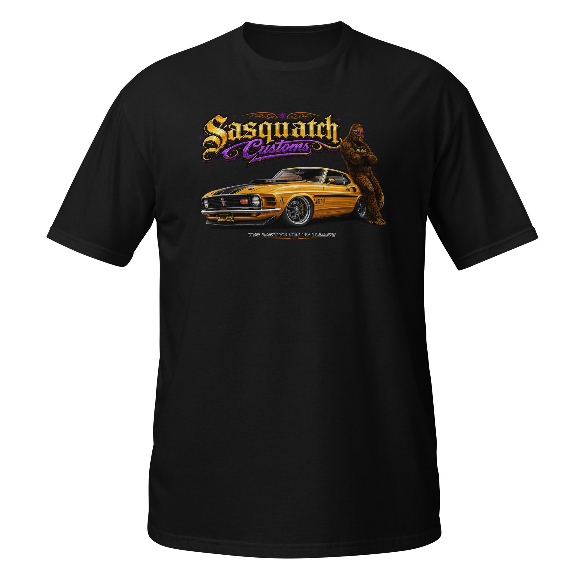 Sasquatch Customs Muscle Car Collection t-shirt — Bigfoot leaning on a 1970 Mustang Mach 1 pro-touring build on billet wheels with arms crossed — funny Sasquatch muscle car tee on black — Rod Shop Collective