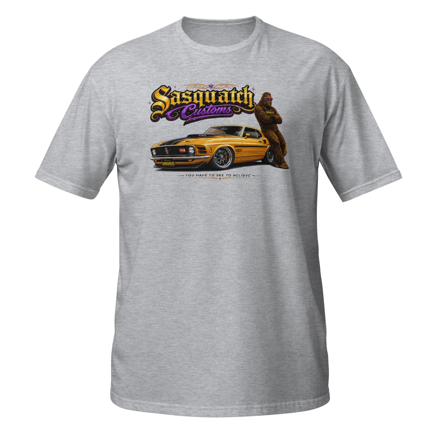 Sasquatch Customs Muscle Car Collection t-shirt — Bigfoot leaning on a 1970 Mustang Mach 1 pro-touring build on billet wheels with arms crossed — funny Sasquatch muscle car tee on gray — Rod Shop Collective