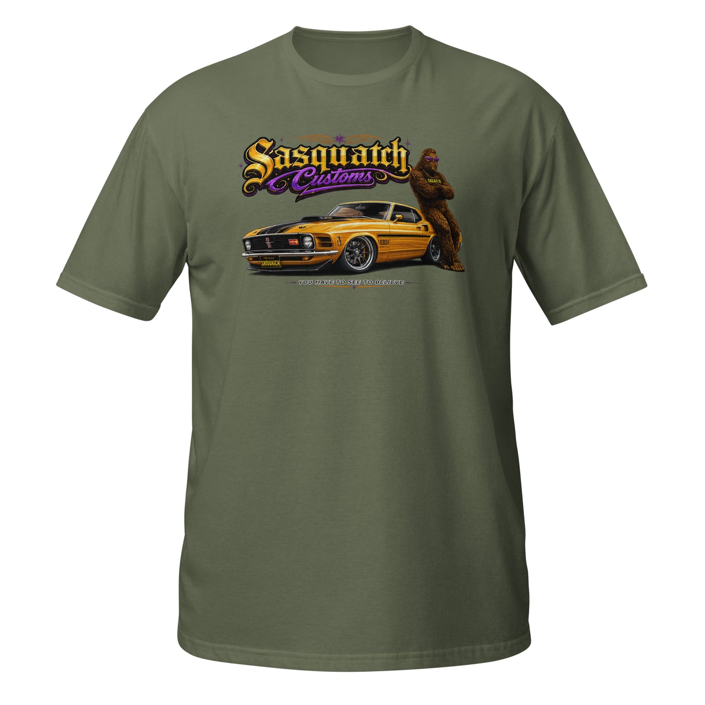 Sasquatch Customs Muscle Car Collection t-shirt — Bigfoot leaning on a 1970 Mustang Mach 1 pro-touring build on billet wheels with arms crossed — funny Sasquatch muscle car tee on military green — Rod Shop Collective
